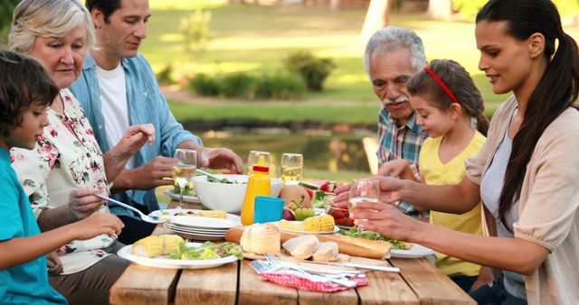 Family Enjoying Outdoor Picnic Together - Download Free Stock Images Pikwizard.com