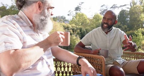 Senior Friends Engaging in Coffee Conversation Outdoors