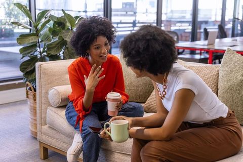 Diverse Friends Engaging in Relaxing Conversation Over Coffee