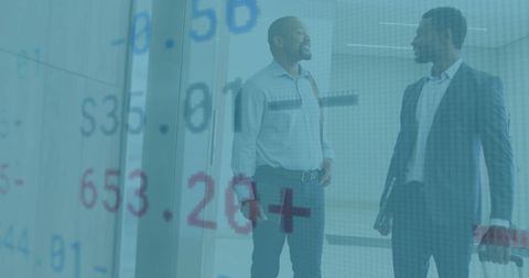 Business Professionals Discussing Financial Data Reflection