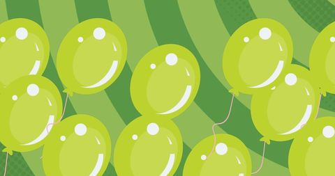 Bright green balloons floating on bold green backdrop