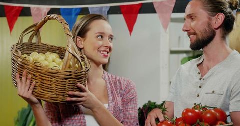 Farmers Selling Fresh Produce and Smiling at Market Stall