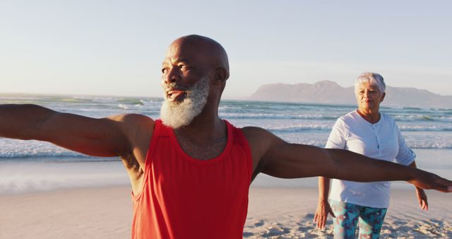 Senior african american couple practising yoga at the beach - Download Free Stock Photos Pikwizard.com