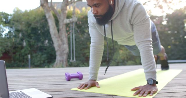 Man Exercising with Online Fitness Class in Outdoor Setup - Download Free Stock Images Pikwizard.com