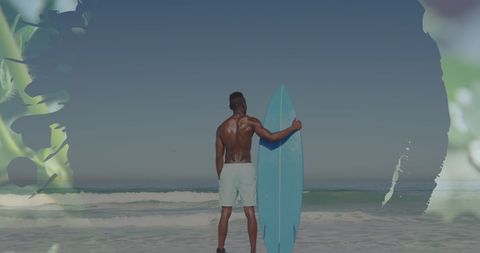 Male Surfer Standing With Blue Surfboard on Sunny Beach