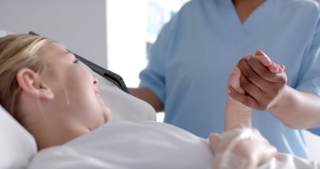 Young Child in Hospital Being Comforted by Nurse - Download Free Stock Images Pikwizard.com