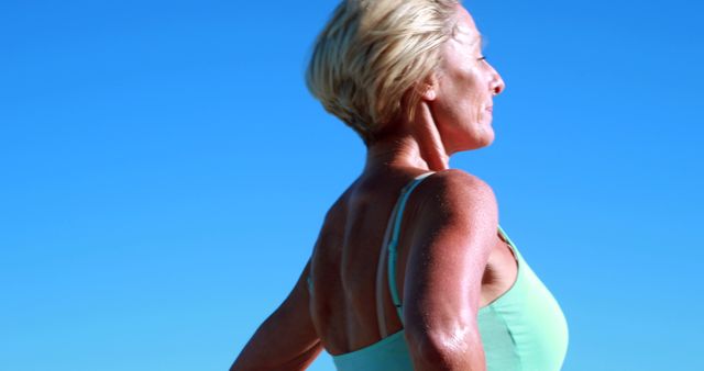 Senior Woman Running Outdoors in Bright Sunlight - Download Free Stock Images Pikwizard.com