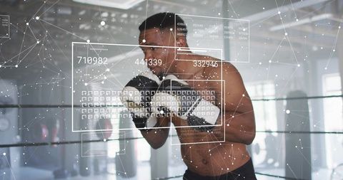 Boxer training with augmented reality HUD tracking punch metrics in industrial gym ring