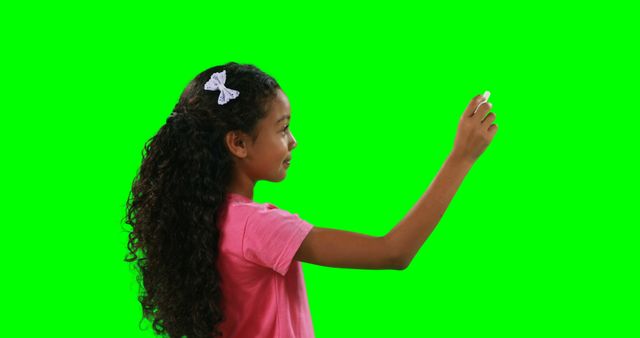 Young Girl Writing with Chalk on Green Background - Download Free Stock Images Pikwizard.com