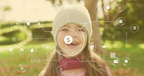 Smiling girl with digital finance hud overlay in sunlit park for fintech and savings
