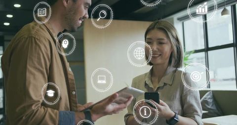 Colleagues collaborating with digital information overlay in modern workplace