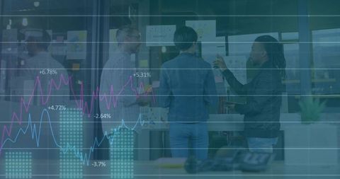 Business team collaborating at glass wall with sticky notes and data visualization overlay