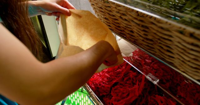 Person Extracting Fresh Produce from Bulk Store Bins - Download Free Stock Images Pikwizard.com