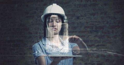 Female architect engaged with 3d interactive city model