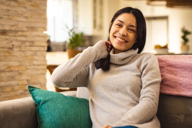 Portrait of happy biracial woman smiling in living room - Download Free Stock Photos Pikwizard.com