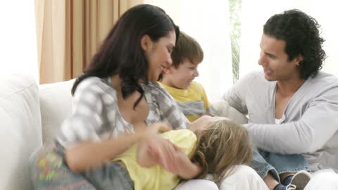Joyful Family Enjoying Quality Time on Lounge Sofa