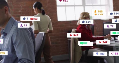 Office team engaging with social media notifications and technology