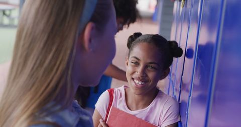 Schoolgirls Socializing by Lockers, Encouraging Inclusivity