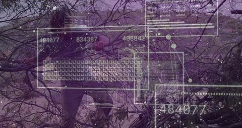 Man pruning scrubland with handsaw under augmented reality forestry data hud overlay