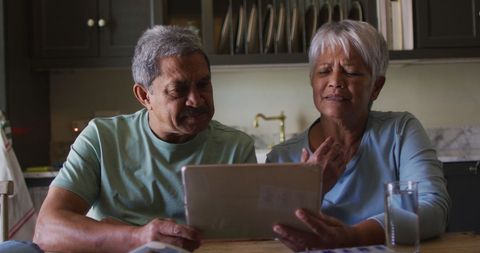 Senior Couple on Tablet for Online Medical Consultation