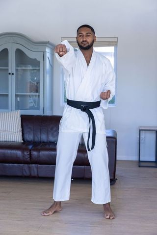 Martial Artist Practicing Punch Technique at Home