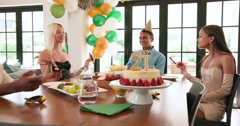Diverse Friends Celebrating 21st Birthday at Bright Party Gathering