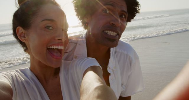 Cheerful Couple Taking Selfie on Beach at Sunset - Download Free Stock Images Pikwizard.com