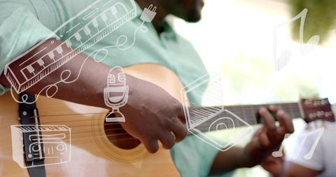 Strumming guitarist fretting acoustic guitar in sunlit park with playful music doodles