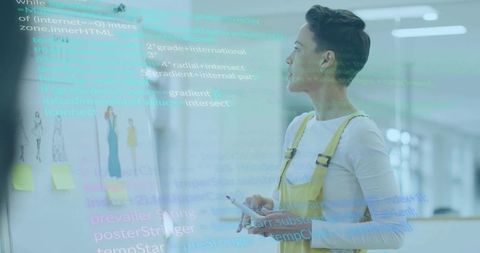 Creative professional analyzing design and code in modern studio