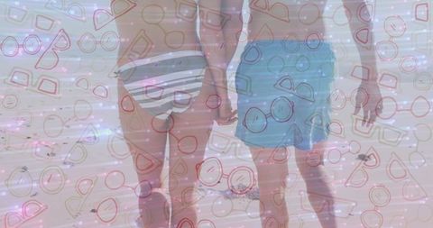 Romantic couple holding hands on scenic beach