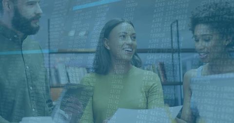 Software developers collaborating on coding project in modern office