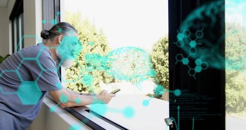 Bearded man leaning at window using smartphone with teal ar brain and molecular hud
