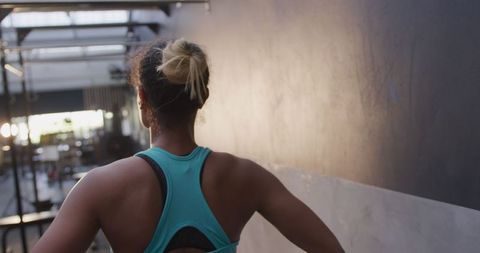 Rear View of Athletic Biracial Woman in Gym Interior - Download Free Stock Images Pikwizard.com