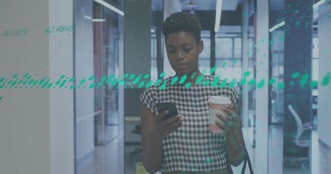 Professional checking smartphone holding coffee walking modern glass urban office corridor