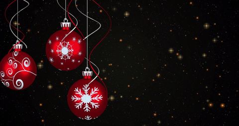 Festive red christmas baubles with starry sky background