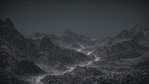 Surreal cosmic hills under starry night sky