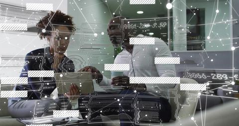 Business professionals reviewing tablet with holographic data overlay in office lounge