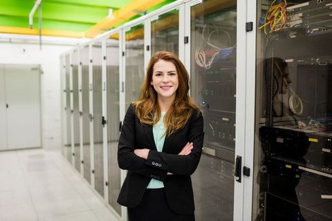 Confident female it specialist in modern data center