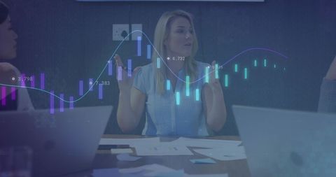 Businesswoman analyzing data with digital charts in office