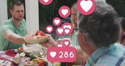 Family Enjoying Outdoor Meal with Social Media Hearts Overlay - Download Free Stock Images Pikwizard.com