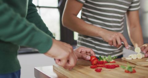 Midsection of Diverse Male Couple Preparing Healthy Smoothie Together
