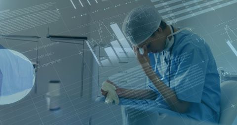 Worried Medical Professional Amidst Graphic Data Overlay