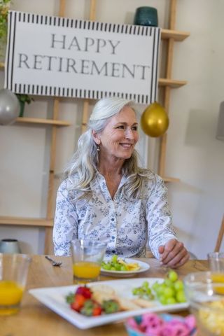 Senior Woman Celebrating Retirement at Joyful Home Gathering