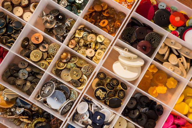 Close-up of various types of buttons in a box