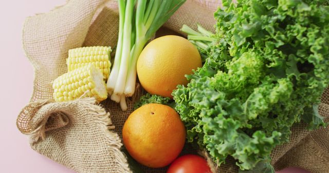 Fresh Organic Produce Featuring Kale, Corn, and Grapefruit on Burlap - Download Free Stock Images Pikwizard.com