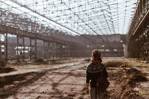 Person Exploring Abandoned Warehouse with Rustic Industrial Interior - Download Free Stock Images Pikwizard.com