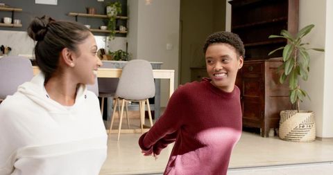 Diverse Female Friends Doing Stretches at Home