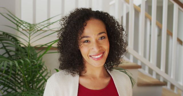 Smiling Woman with Curly Hair at Home - Download Free Stock Images Pikwizard.com