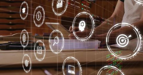 Hands Tapping Tablet with Floating Data Icons and Digital Analytics Interface