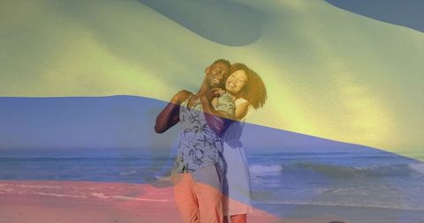 Embracing couple standing at shoreline with translucent flag overlay, summer beach romance